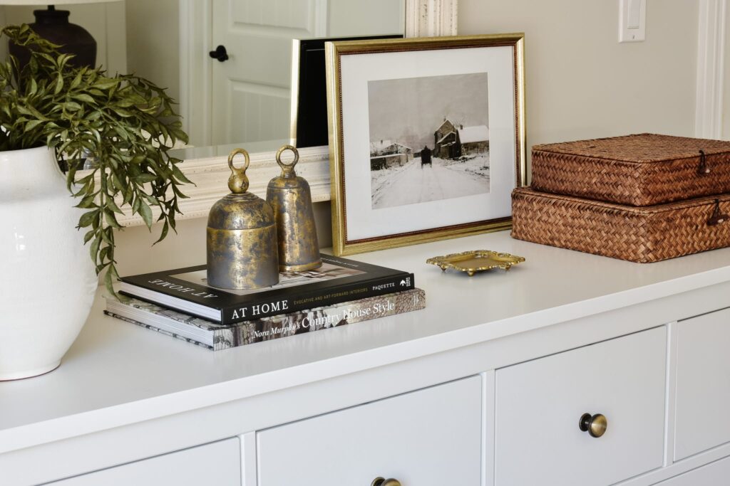 dresser with bells and artwork